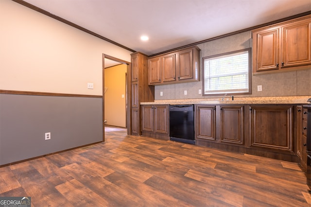 kitchen with black dishwasher, crown molding, dark hardwood / wood-style floors, and sink