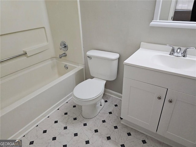 bathroom with toilet, baseboards,  shower combination, and vanity