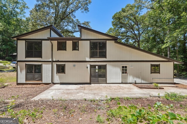 rear view of property featuring a patio