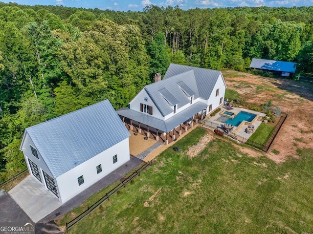 bird's eye view featuring a wooded view