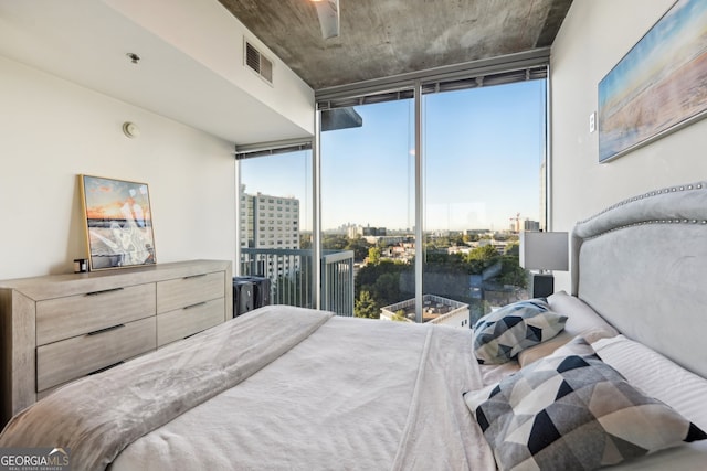 bedroom with access to outside and floor to ceiling windows