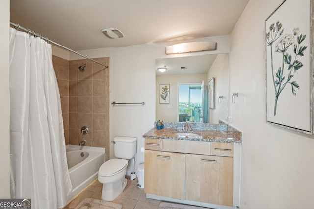 full bathroom featuring toilet, shower / bath combo, vanity, and tile patterned flooring