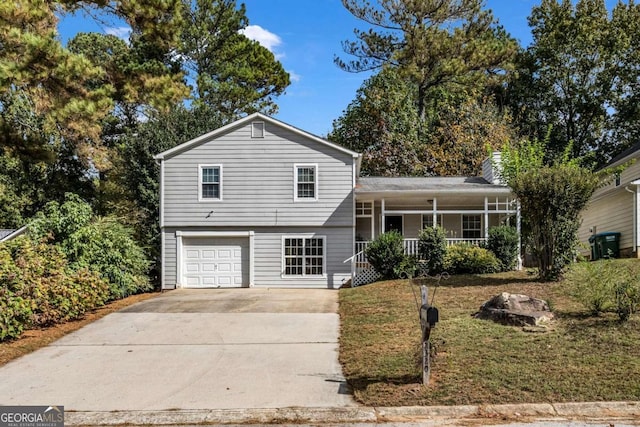 split level home with a porch and a garage