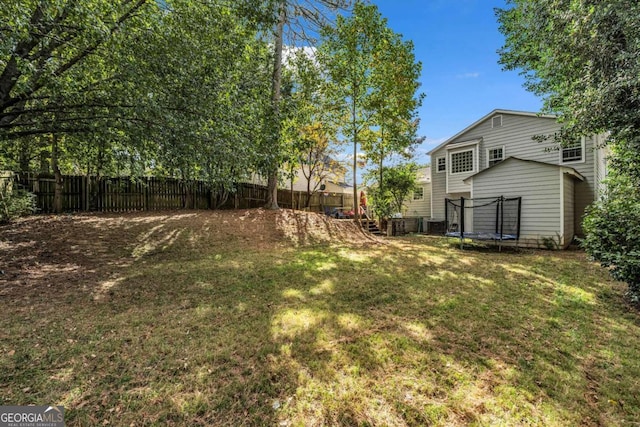 view of yard with a trampoline