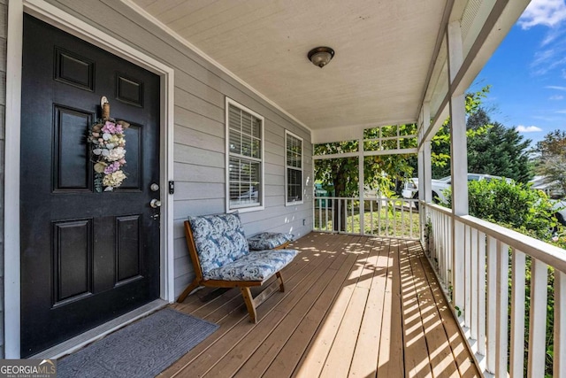 wooden terrace featuring a porch