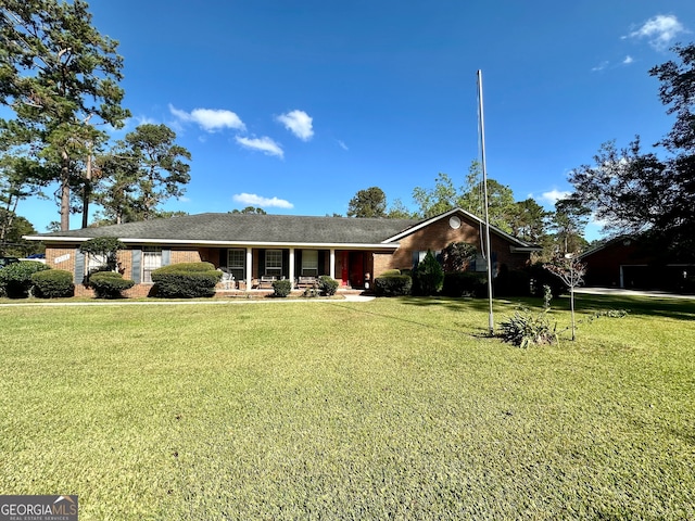 single story home with a front lawn