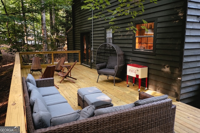 deck featuring outdoor lounge area