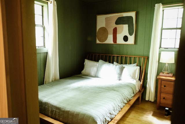 bedroom with hardwood / wood-style flooring