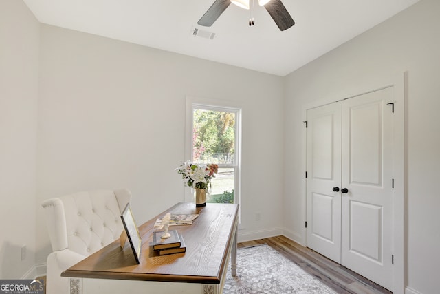 office featuring ceiling fan and light hardwood / wood-style flooring