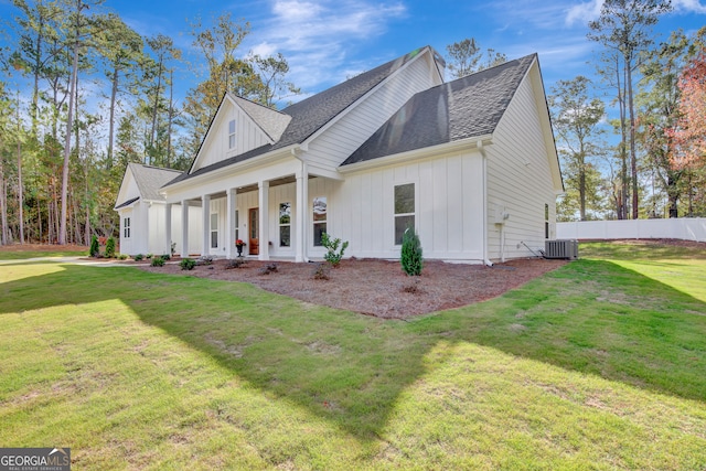 view of front of home featuring a front yard and covered porch