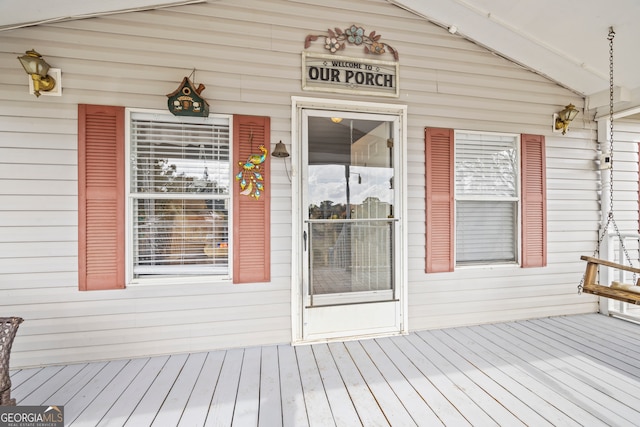 doorway to property featuring a wooden deck