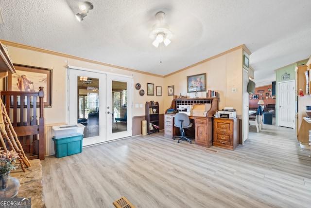 home office featuring french doors, ornamental molding, a textured ceiling, ceiling fan, and light hardwood / wood-style flooring