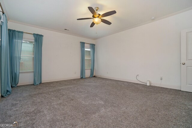 carpeted empty room featuring crown molding and ceiling fan