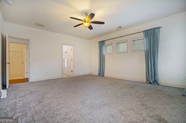 carpeted empty room featuring ornamental molding and ceiling fan