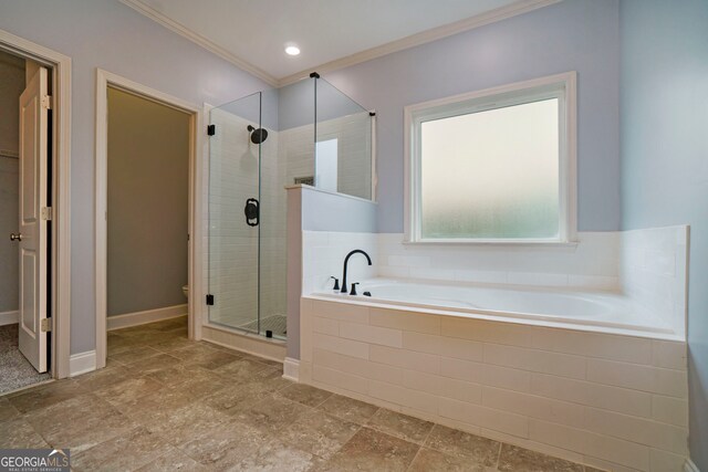 bathroom with ornamental molding and plus walk in shower