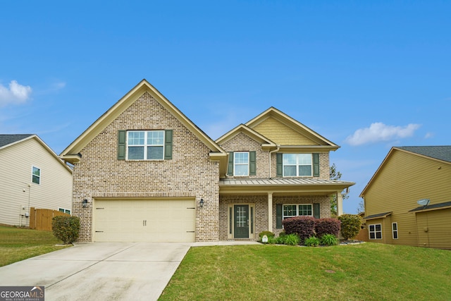 view of front of property featuring a garage and a front lawn