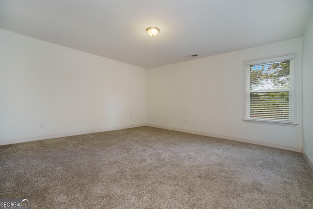 spare room featuring carpet flooring