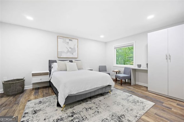 bedroom with wood-type flooring