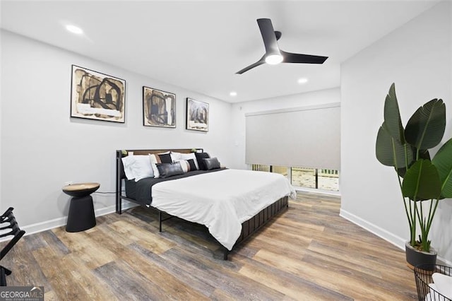 bedroom featuring ceiling fan and hardwood / wood-style flooring