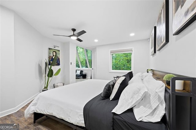 bedroom featuring dark hardwood / wood-style flooring and ceiling fan