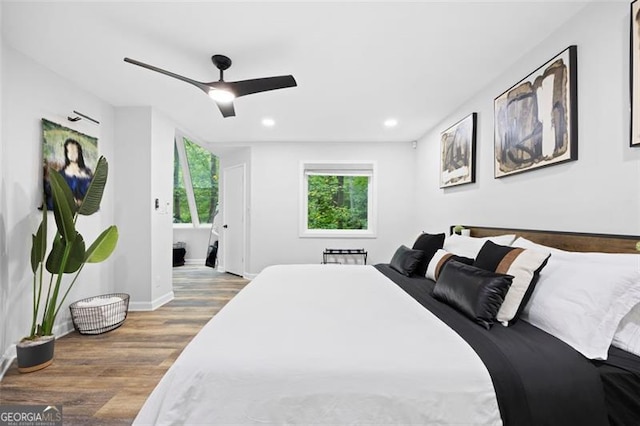 bedroom with hardwood / wood-style flooring and ceiling fan