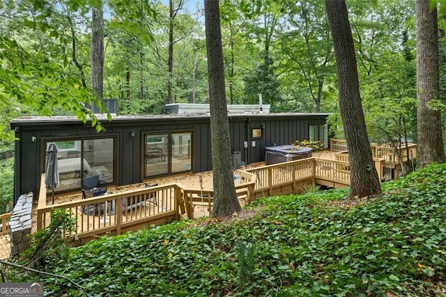 back of property with a wooden deck