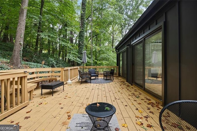 deck featuring outdoor lounge area