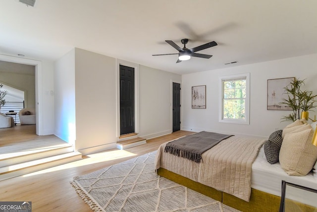 bedroom featuring ceiling fan and light wood-type flooring