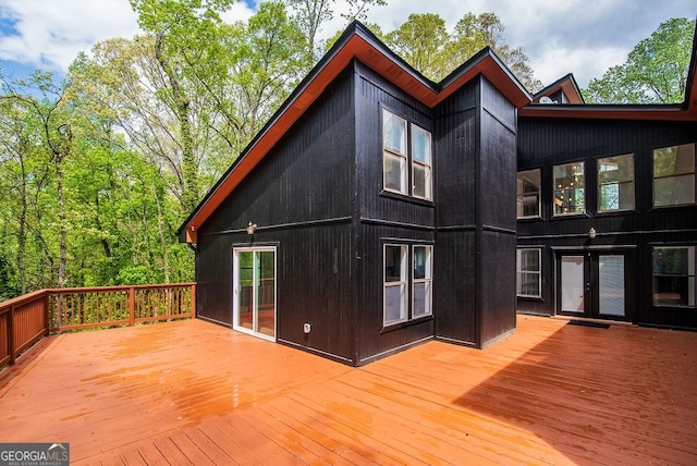 exterior space with a deck and french doors