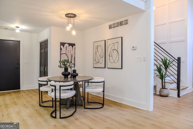 dining area with light hardwood / wood-style flooring