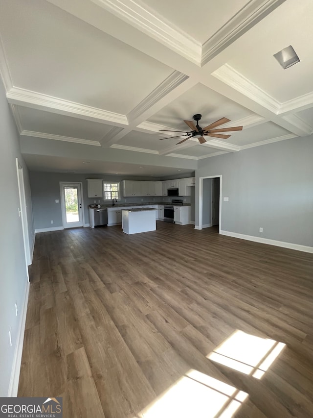 unfurnished living room featuring crown molding, dark hardwood / wood-style flooring, ceiling fan, coffered ceiling, and beam ceiling