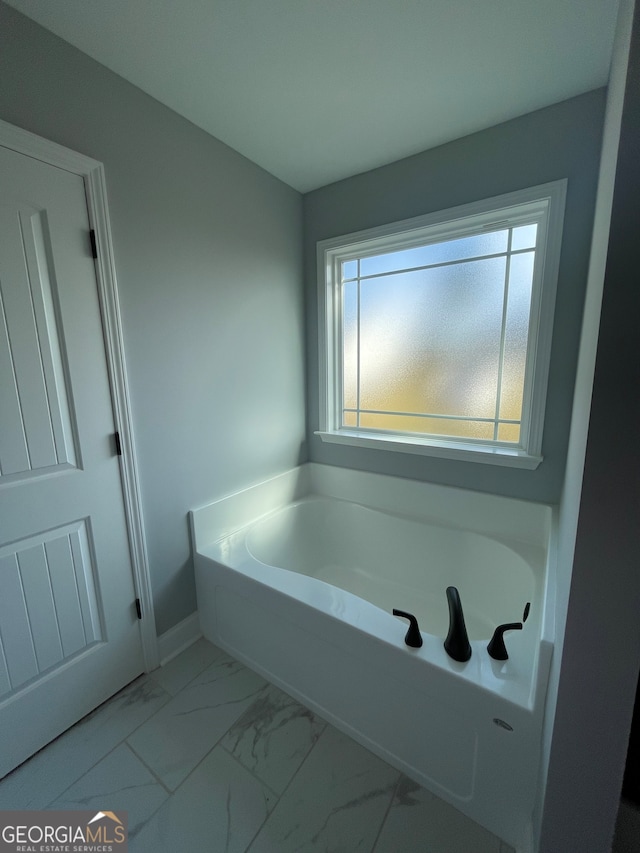 bathroom featuring a tub