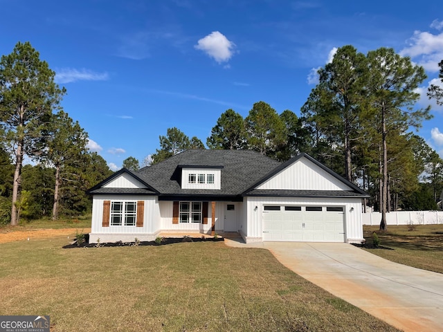 view of front facade featuring a garage and a front lawn