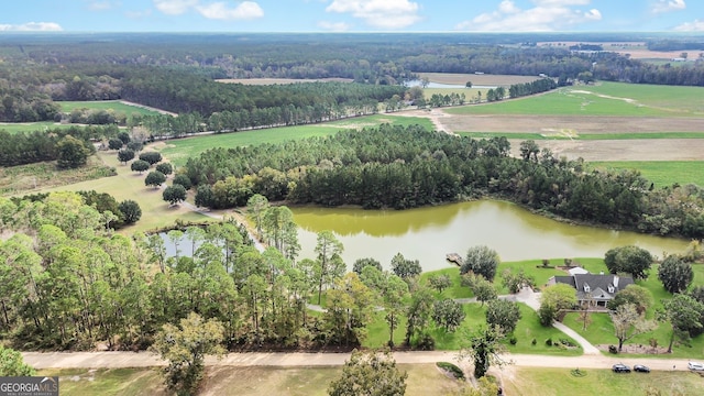 birds eye view of property featuring a rural view and a water view