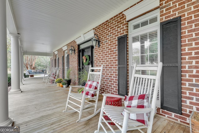 wooden terrace with a porch