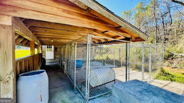 view of patio featuring an outbuilding