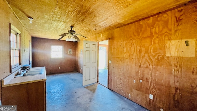 interior space with ceiling fan and sink