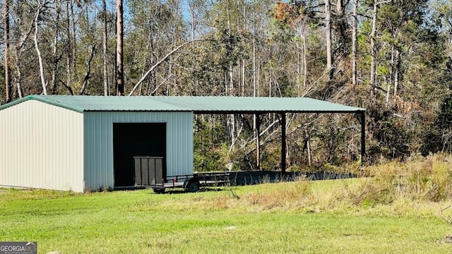 view of outbuilding with a lawn