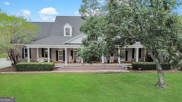 view of front of home featuring a front lawn and a porch