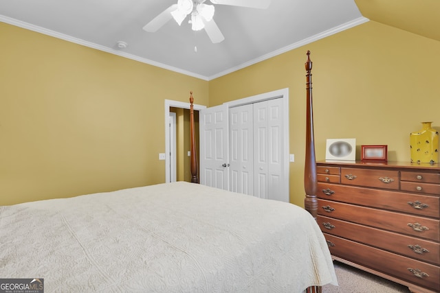 carpeted bedroom featuring a closet, vaulted ceiling, ceiling fan, and ornamental molding