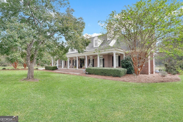 view of front of property with a front lawn and a porch