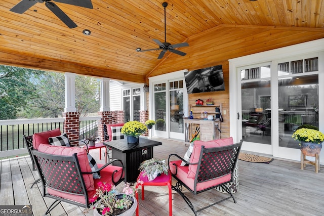 sunroom with wooden ceiling, ceiling fan, and lofted ceiling