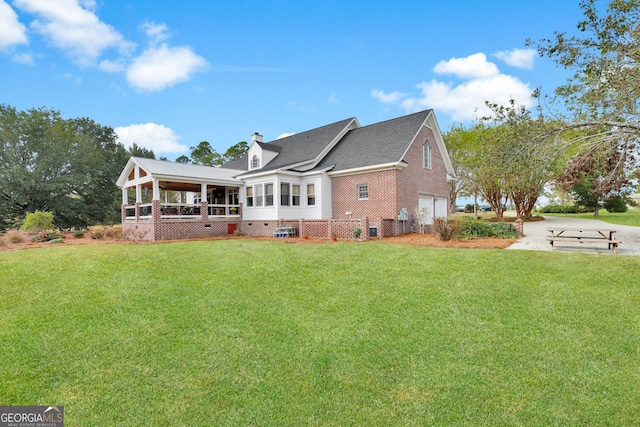 back of house with a lawn