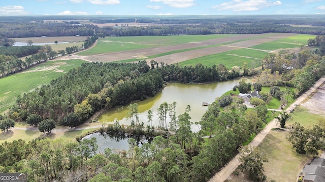 aerial view with a rural view and a water view