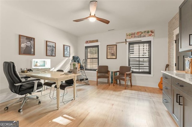 bedroom featuring light wood-type flooring and ceiling fan