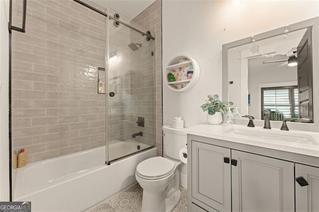 interior space with ensuite bath, light hardwood / wood-style flooring, and ceiling fan