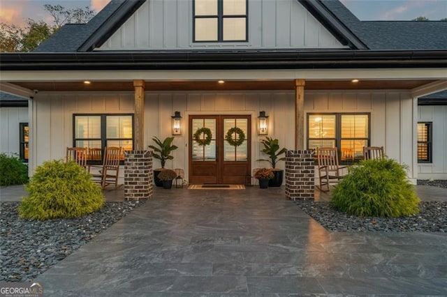 exterior entry at dusk with a porch