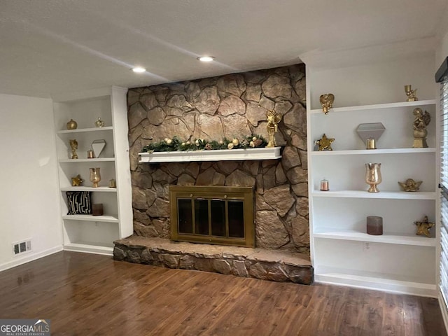 unfurnished living room with wood-type flooring and a fireplace