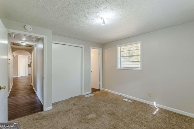 6275 S Skyline Dr, Douglasville, GA 30135 - unfurnished bedroom featuring carpet floors, attic access, baseboards, visible vents, and a closet