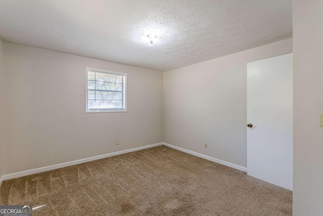 6275 S Skyline Dr, Douglasville, GA 30135 - carpeted spare room with baseboards and a textured ceiling
